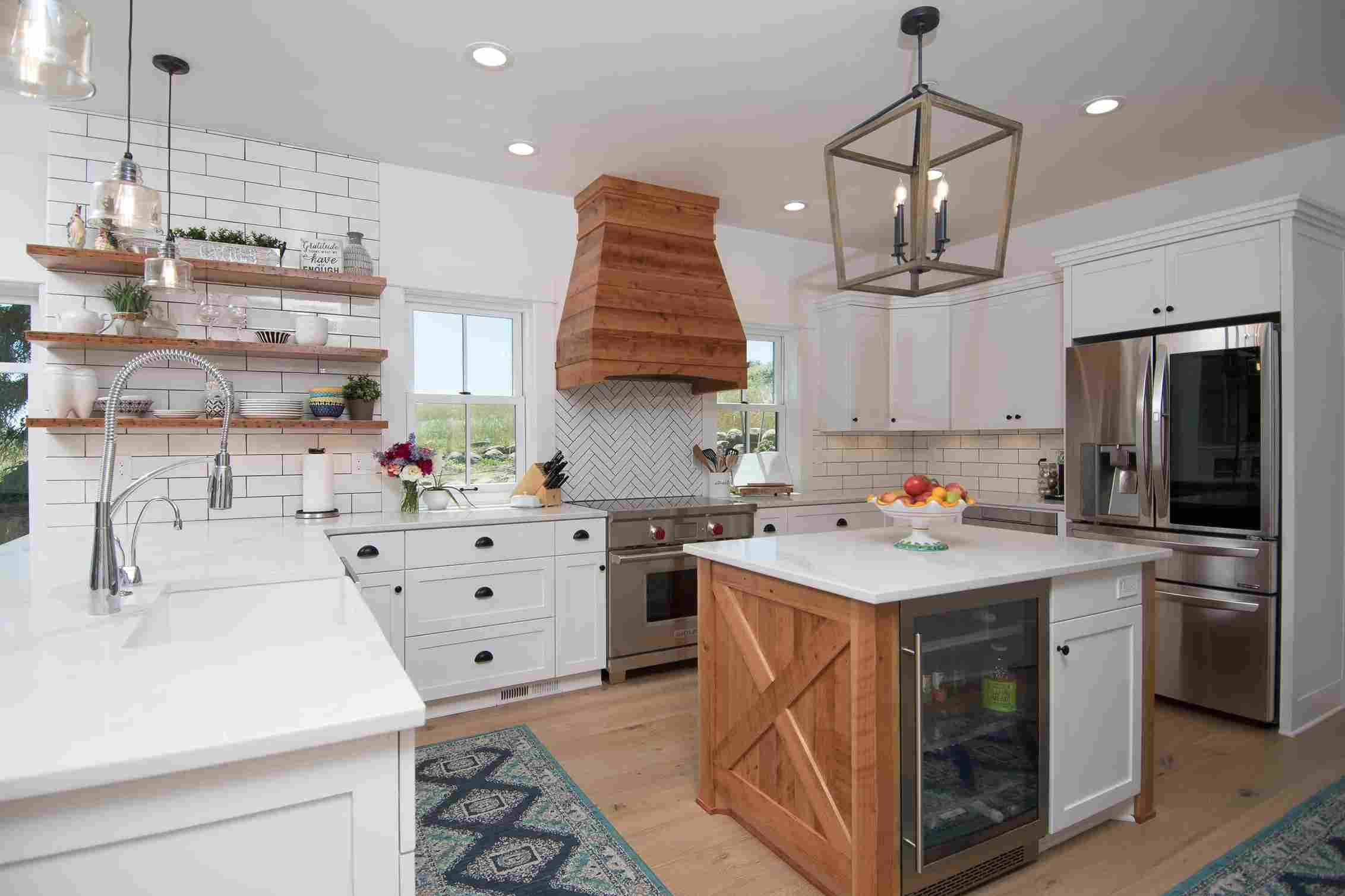 brown wooden luxury kitchen with island by kraft custom construction