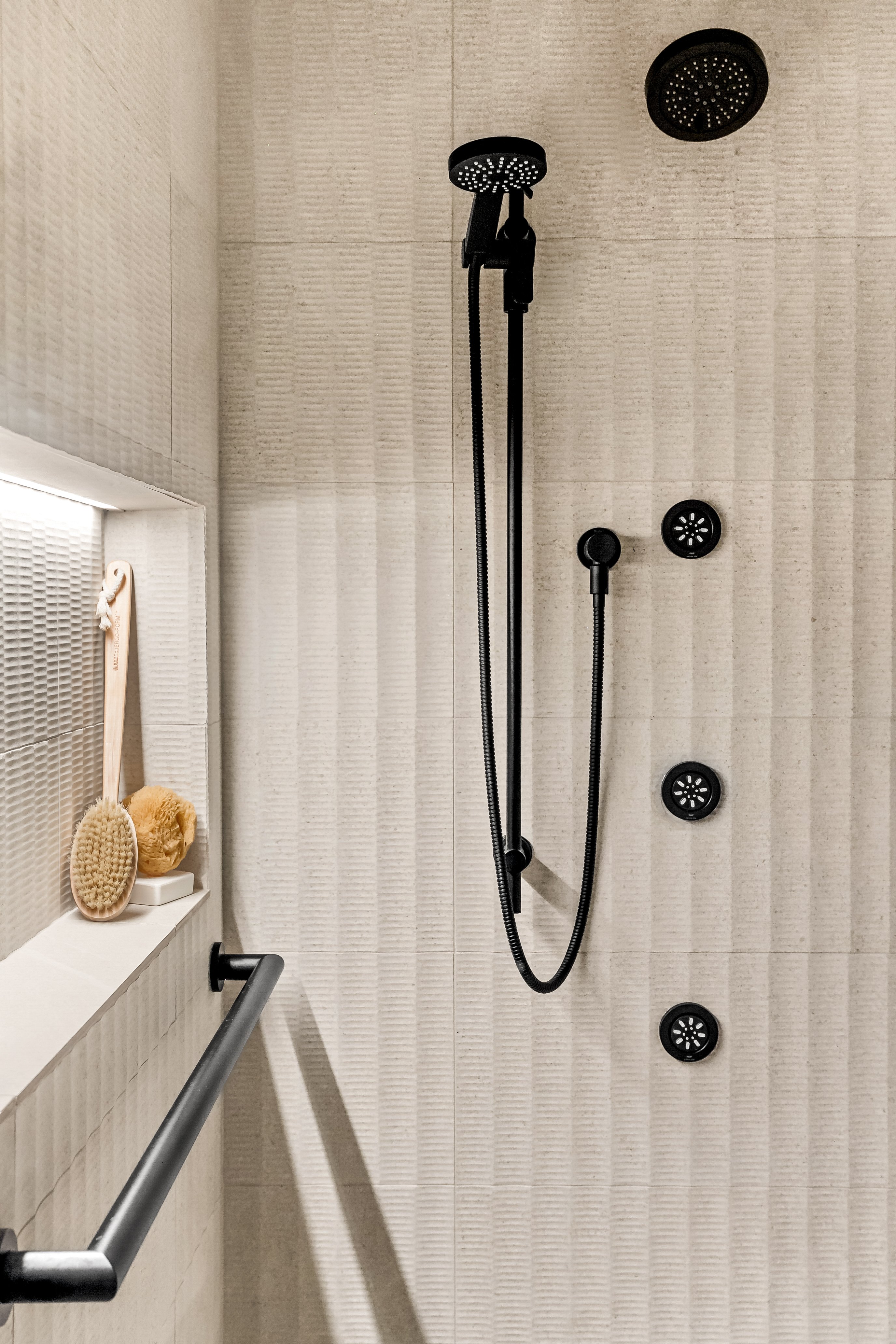 Fluted Porcelain Tile and Matte Black Shower Hardware