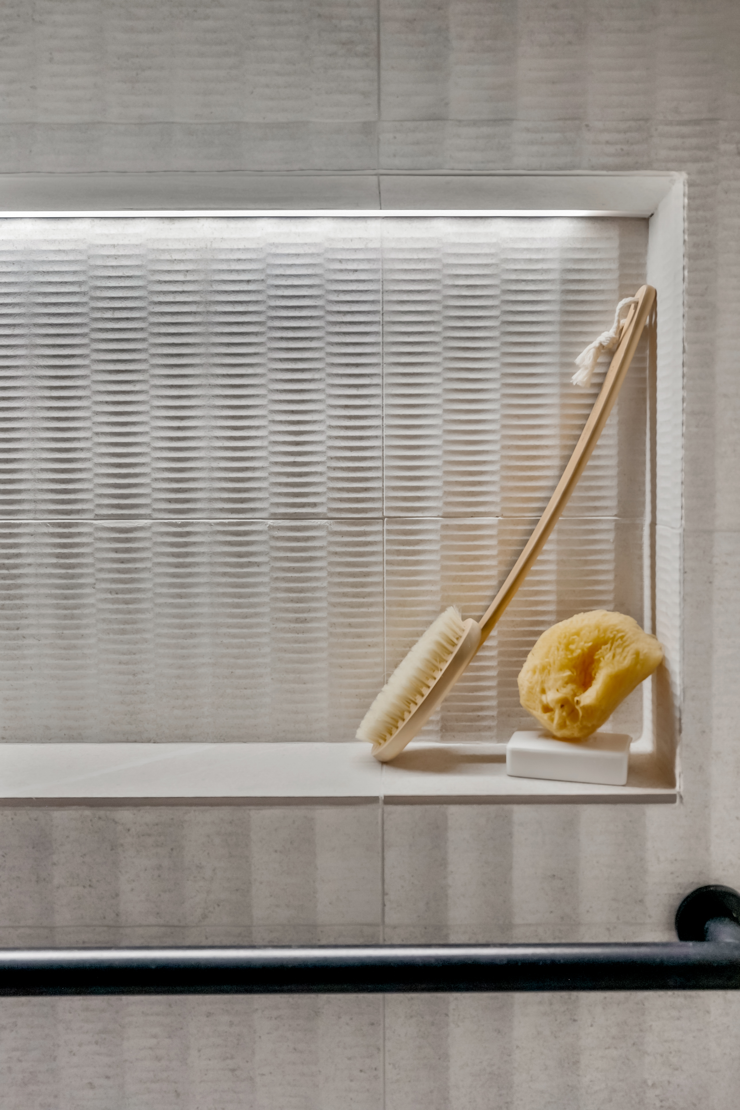 Bathroom Product Niche With Cove Lighting And Grab Bars