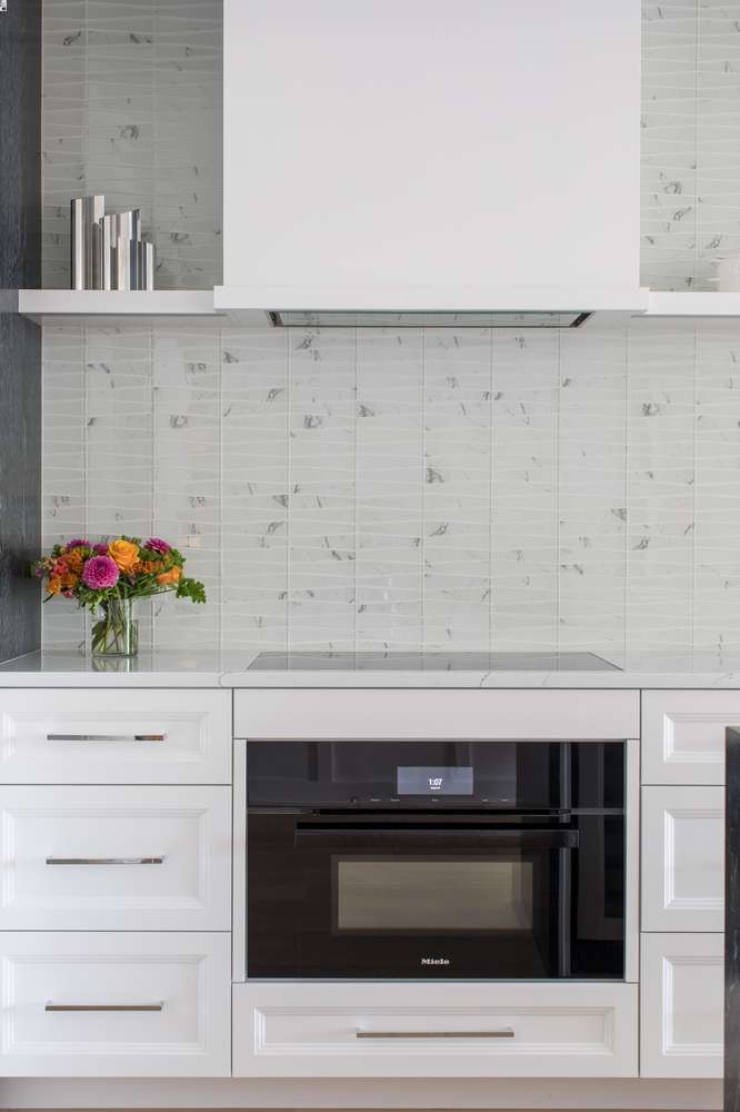 Stove and cooktop with glass tile backsplash