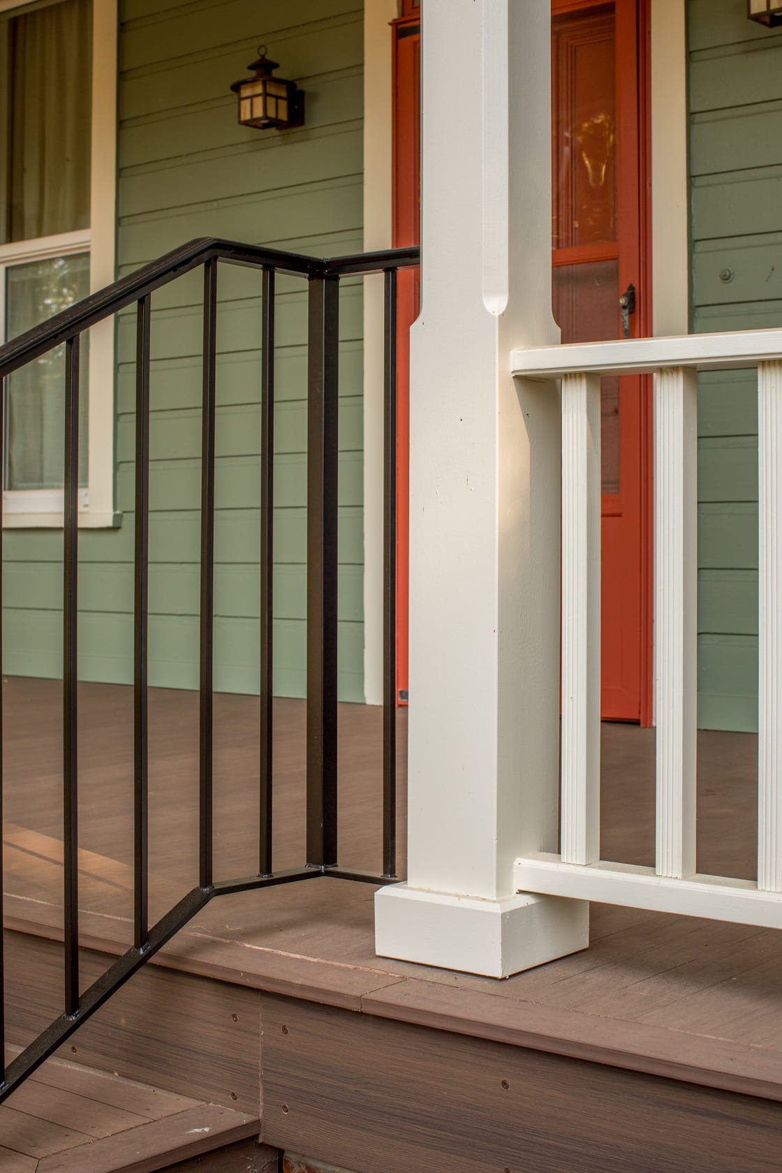 close shot of remodeled porch with black rail and brown stairs in Salem, Oregon by Kraft Custom Construction