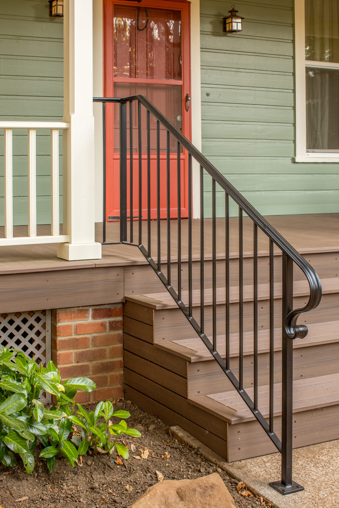 close shot of remodeled porch with black rail and brown stairs in Salem, Oregon by Kraft Custom Construction