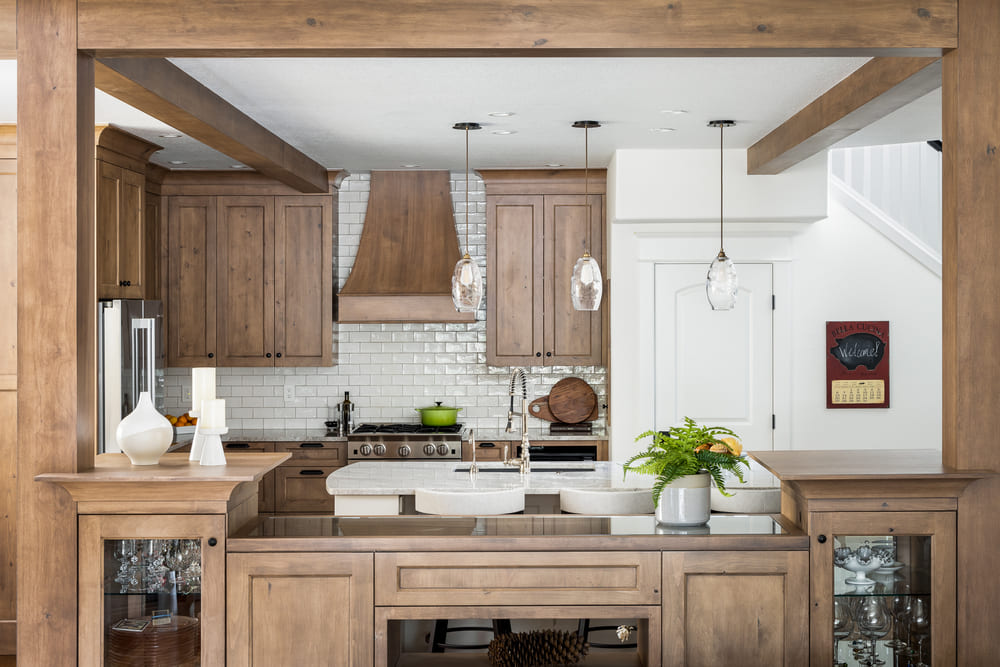 interior of French-Country Kitchen Remodel with wood finishes in Tualatin, Oregon by Kraft Custom Construction