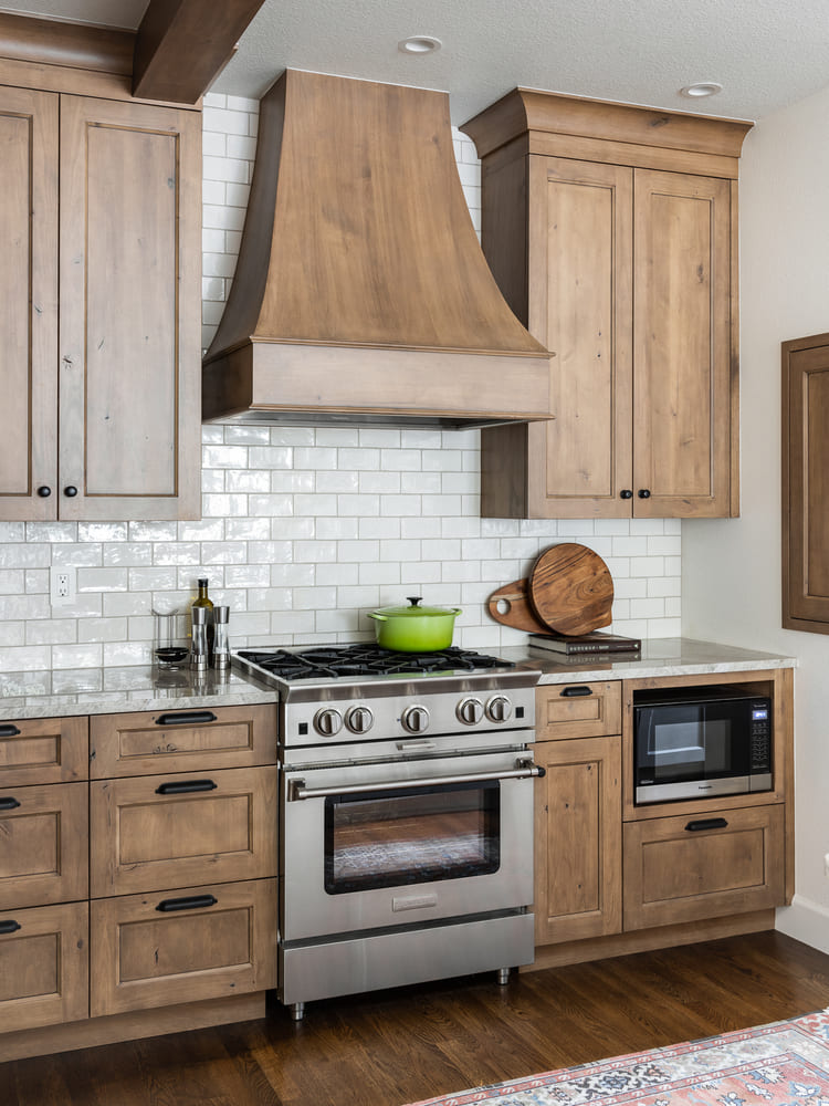 interior of French-Country Kitchen Remodel with wood finishes in Tualatin, Oregon by Kraft Custom Construction